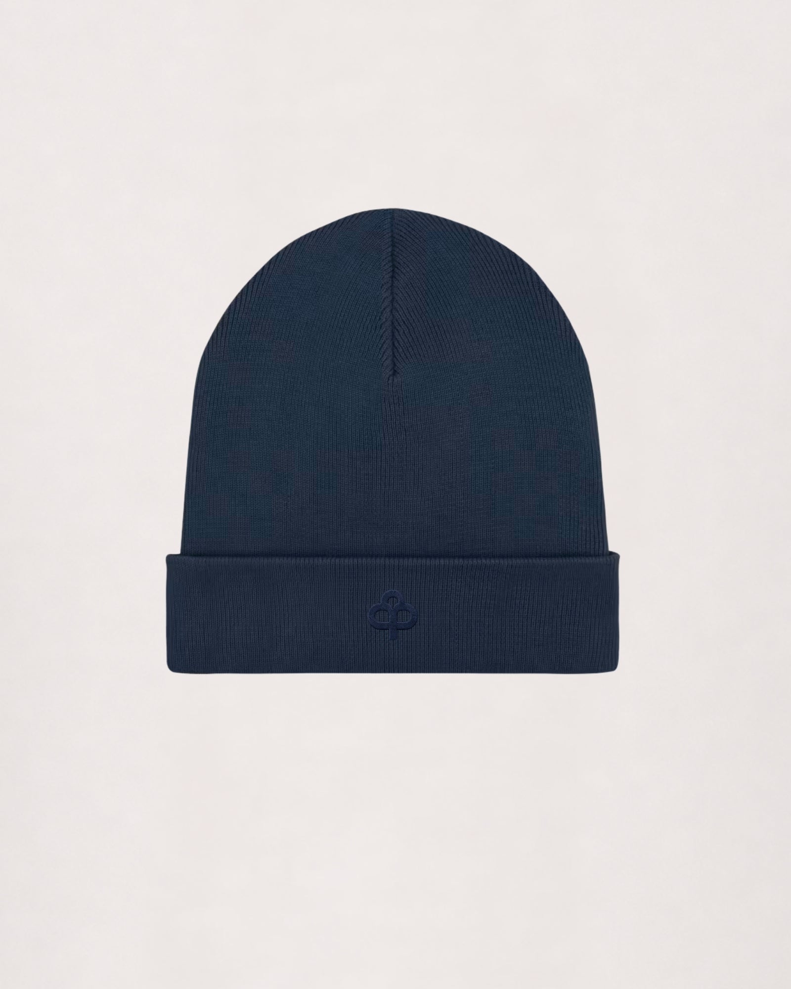 Ribbed beanie in navy, flat lay with turn-up cuff and embroidered logo