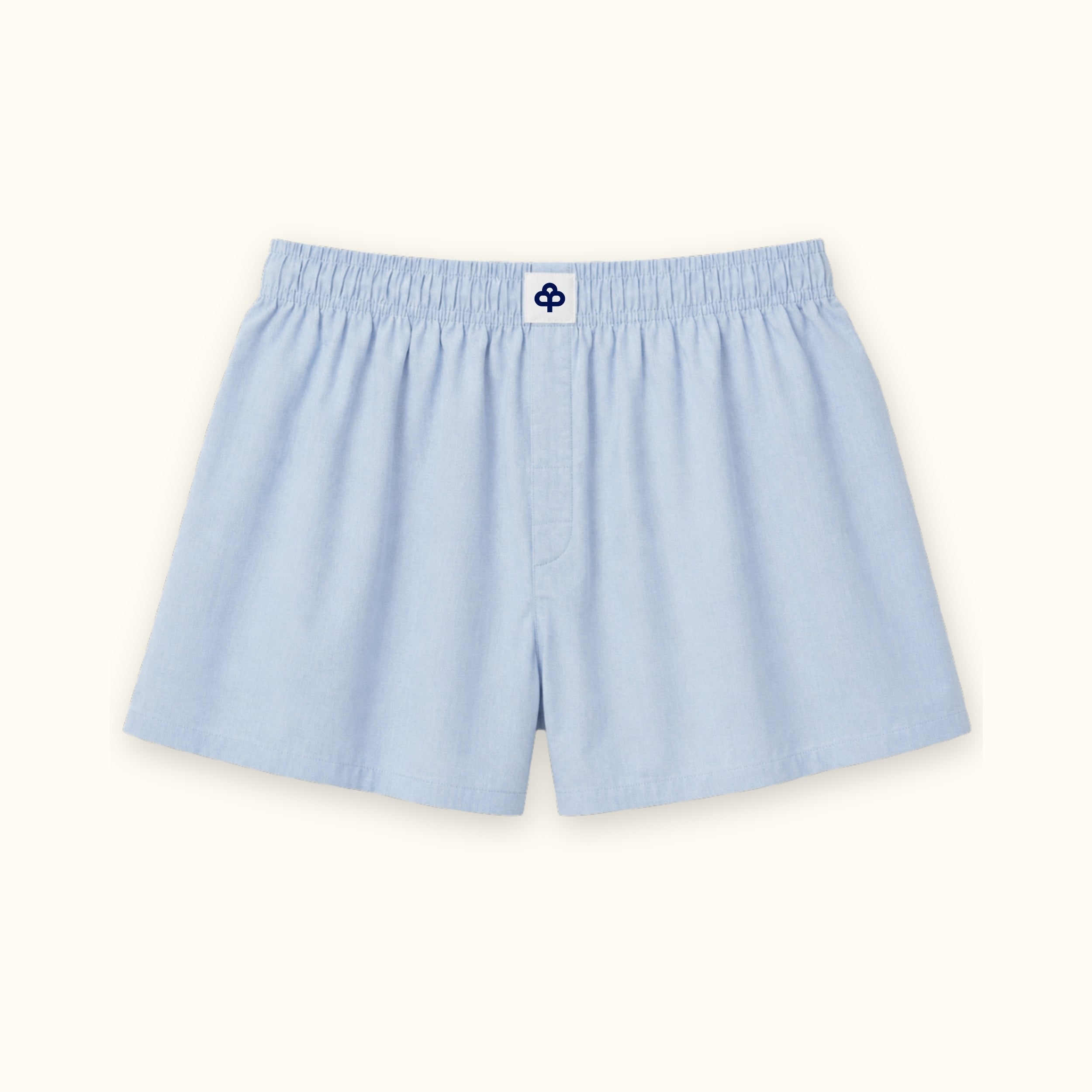 Short boxer en coton bleu clair, vue de face, montrant la ceinture et la forme de la jambe