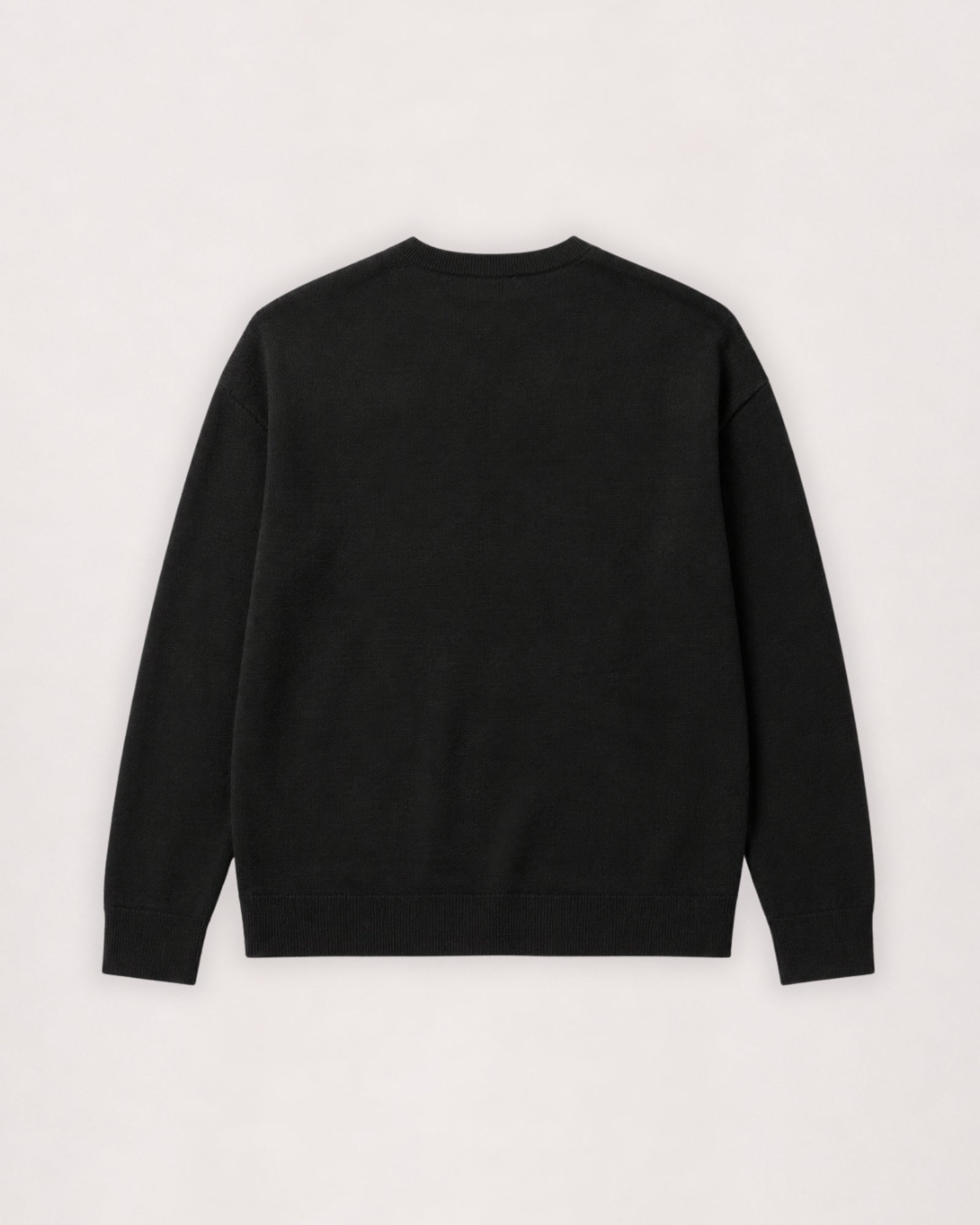 Merino crew neck sweater in black, flat lay back view