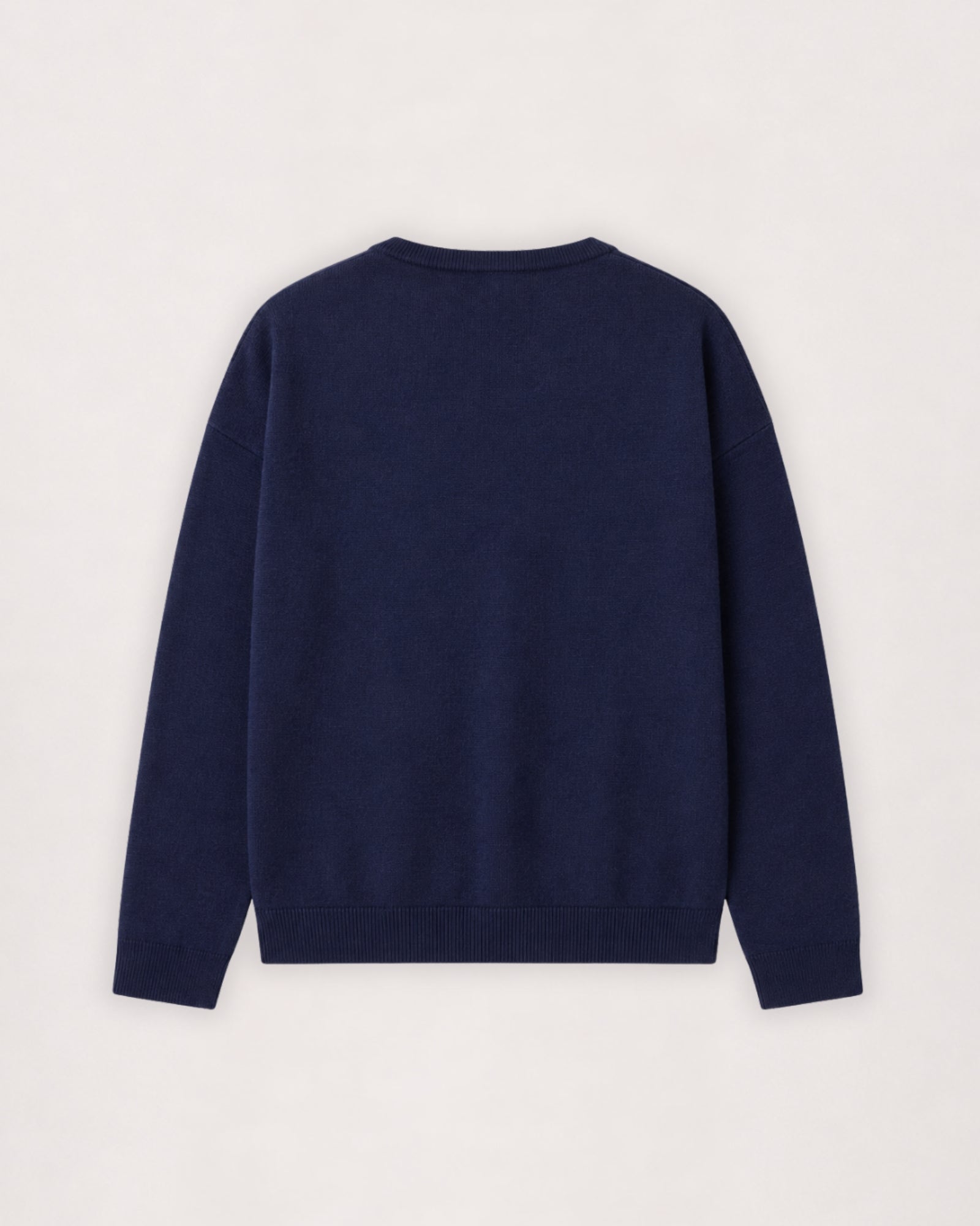 Merino crew neck sweater in navy, flat lay back view