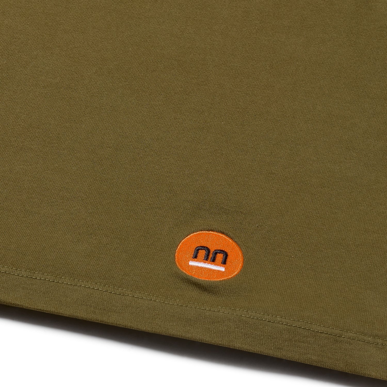 Close-up of the khaki t-shirt's fabric texture.