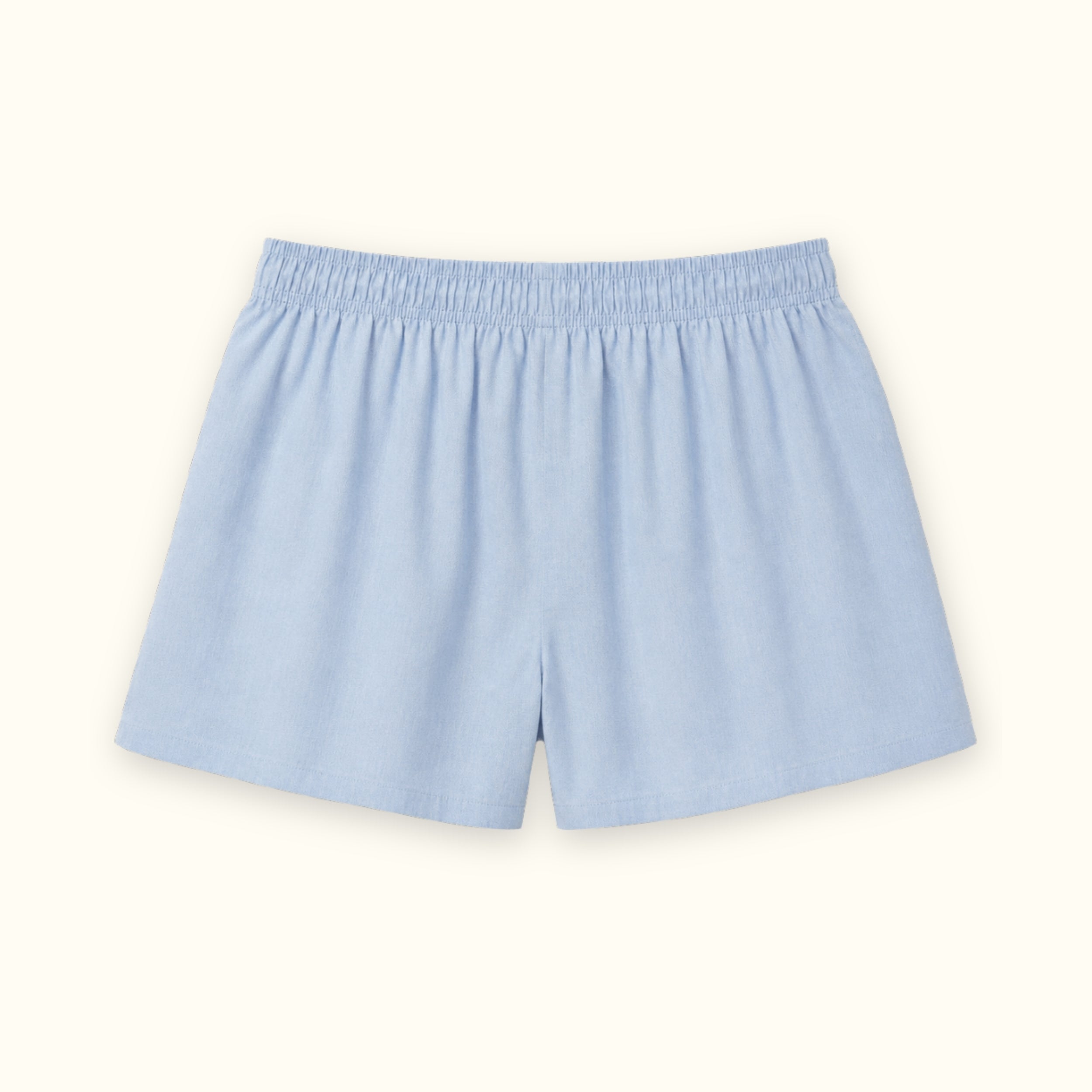 Short tipo bóxer de algodón en azul claro, vista trasera, mostrando la cintura y la forma de la pernera