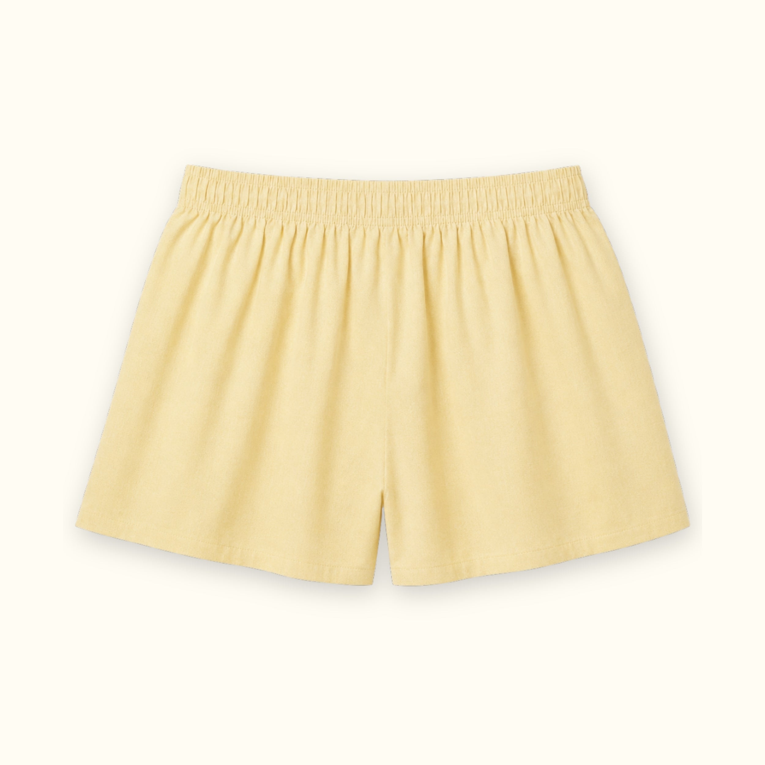 Short boxer en coton jaune clair, vue de dos, montrant la ceinture et la forme de la jambe