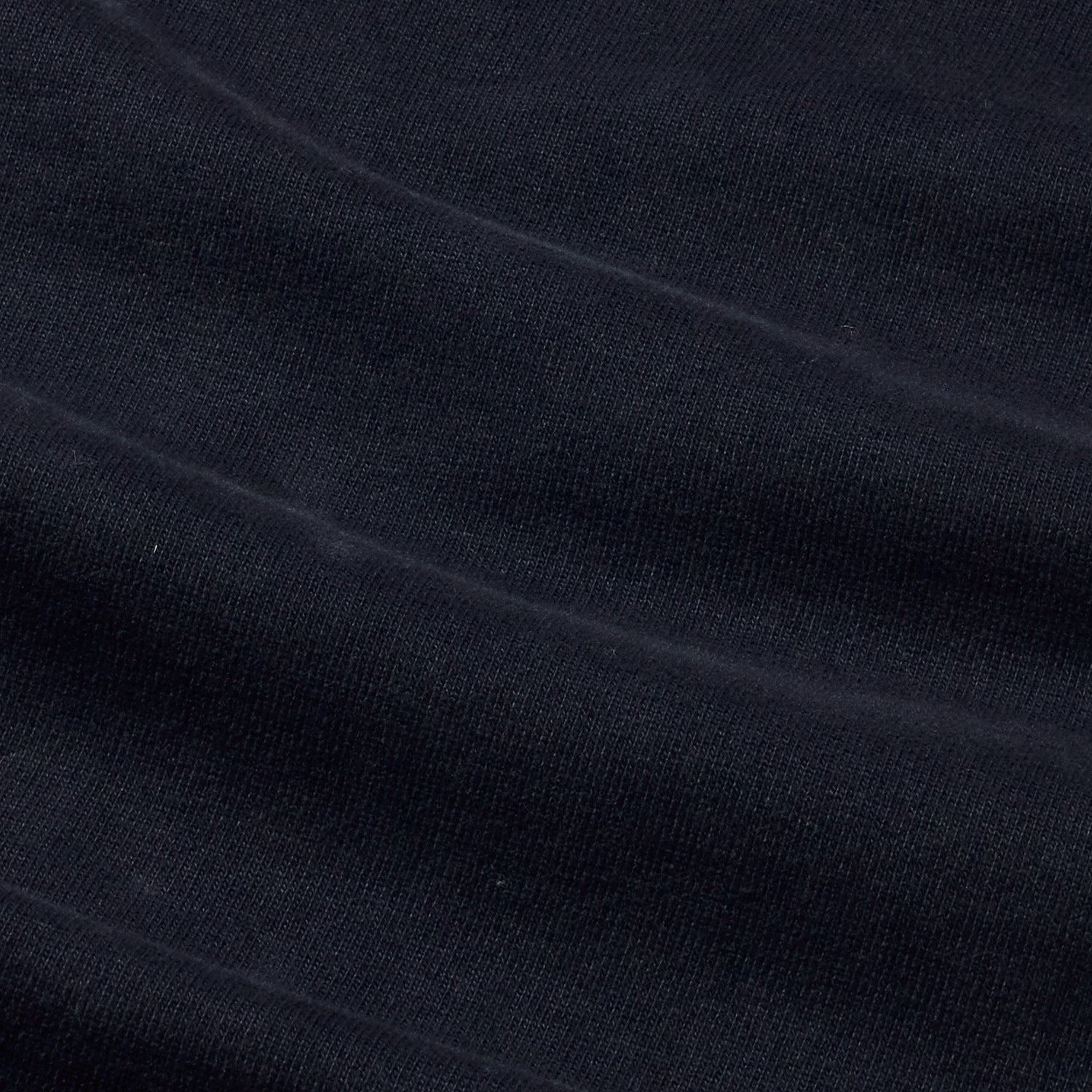 Close up navy organic cotton fabric with sleeve details